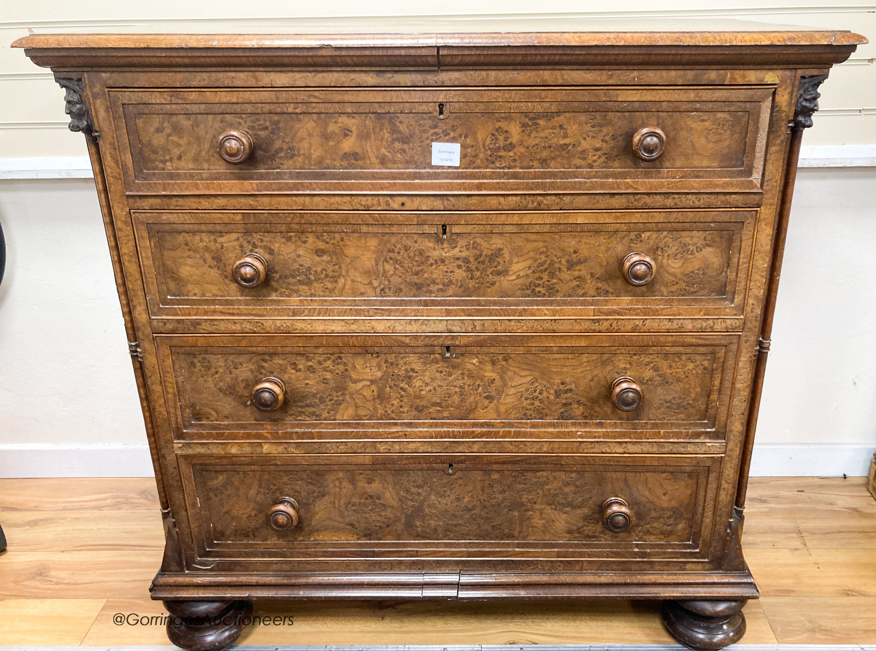 A mid 19th century oak and pollard oak chest fitted four long graduated drawers, width 114cm, depth 59cm, height 113cm